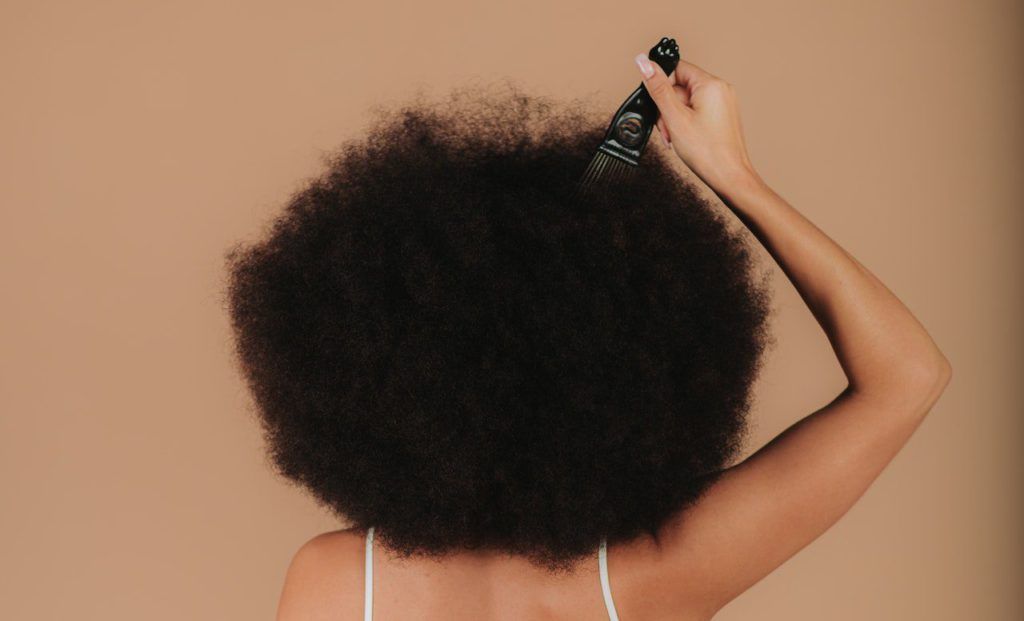 Picking afro hair.